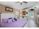 Bright main bedroom with luxury white furnishings, neutral paint, and tiled flooring at 13045 Marbled Godwit Rd, Weeki Wachee, FL 34614