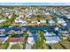 Aerial view of waterfront community with canals, docks, and residences at 13906 Barnard Ave, Hudson, FL 34667