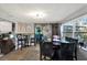 Bright dining area with comfortable seating, modern decor, and open kitchen access at 13906 Barnard Ave, Hudson, FL 34667