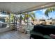 Screened-in lanai offering panoramic views of the canal and outdoor scenery at 13906 Barnard Ave, Hudson, FL 34667