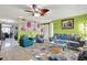 Cozy living room with eye catching decor, a modern ceiling fan, and lots of character at 13906 Barnard Ave, Hudson, FL 34667