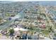 Aerial shot of a waterfront community with canal access, showcasing the neighborhood's layout and proximity to the water at 13930 Berkowitz Ave, Hudson, FL 34667