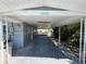Carport with the address 13930 painted above the opening at 13930 Berkowitz Ave, Hudson, FL 34667