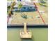 Aerial shot of a home with a private dock and lush green lawn at 13930 Berkowitz Ave, Hudson, FL 34667