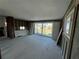 Unfinished living room featuring sliding glass doors to backyard and view of the water at 13930 Berkowitz Ave, Hudson, FL 34667
