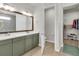 Bathroom with dual sink vanity and walk-in closet at 1436 Gopher Loop, Tarpon Springs, FL 34689