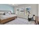 Bright bedroom with three windows and an exercise bike at 1436 Gopher Loop, Tarpon Springs, FL 34689