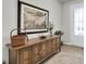 Welcoming entryway featuring stylish console table and artwork, setting a tone of refined taste at 1436 Gopher Loop, Tarpon Springs, FL 34689