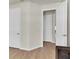Open living area with wood-look floors, bright white trim and doorways, with a comfortable vibe at 1436 Gopher Loop, Tarpon Springs, FL 34689