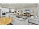 Open-concept living room and kitchen, perfect for entertaining and modern living at 1436 Gopher Loop, Tarpon Springs, FL 34689