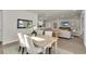 Open-concept space features a dining area and living room at 1436 Gopher Loop, Tarpon Springs, FL 34689