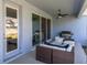 Outdoor patio with comfortable seating, BBQ grill, and access to backyard at 1436 Gopher Loop, Tarpon Springs, FL 34689