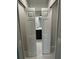 Open closet doors lead into a bright bathroom at 1713 Walden Ct, Englewood, FL 34224