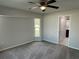 This bedroom features a ceiling fan, neutral gray paint, and a window at 1713 Walden Ct, Englewood, FL 34224
