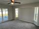 Bedroom with natural light and access to the outside patio at 1713 Walden Ct, Englewood, FL 34224