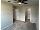 Comfortable bedroom with ceiling fan and closet at 1713 Walden Ct, Englewood, FL 34224