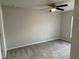 Neutral-toned bedroom with a ceiling fan and ample natural light at 1713 Walden Ct, Englewood, FL 34224