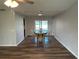 Dining room showcasing a wooden table, chairs, and hardwood flooring at 1713 Walden Ct, Englewood, FL 34224