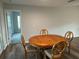Dining room featuring classic hardwood floors, a wooden dining table, and chairs, perfect for Gathering meals at 1713 Walden Ct, Englewood, FL 34224
