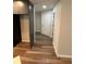 Hallway featuring wood-look flooring that leads to the front door at 1713 Walden Ct, Englewood, FL 34224