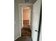 Bright hallway with modern wood flooring leading to the bedroom at 1713 Walden Ct, Englewood, FL 34224