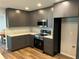 Well-appointed kitchen featuring modern appliances, ample counter space, and stylish gray cabinetry for a contemporary look at 1713 Walden Ct, Englewood, FL 34224