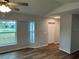 Living room with natural light and hardwood floors at 1713 Walden Ct, Englewood, FL 34224