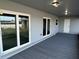 Covered back patio with plenty of space for outdoor living at 1713 Walden Ct, Englewood, FL 34224