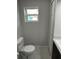 Toilet room with window at 1713 Walden Ct, Englewood, FL 34224