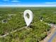 Beautiful aerial view of homesite with mature trees, offering privacy and a serene atmosphere at 18082 Parakeet Rd, Brooksville, FL 34614