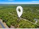 Lush aerial view of new home homesite surrounded by mature trees, offering a tranquil setting at 18082 Parakeet Rd, Brooksville, FL 34614