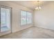 Bright dining area featuring neutral walls, tile flooring, and natural light at 2433 Fairview Rd, Spring Hill, FL 34609