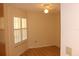 A naturally lit bedroom with wood floors and adjustable window shutters at 2568 W Brook Ln, Clearwater, FL 33761