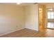 Bright bedroom with wood floors, a closet with mirror doors, and an attached bathroom at 2568 W Brook Ln, Clearwater, FL 33761