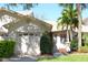 Beautiful home exterior with lush landscaping, manicured lawn, and an attached one-car garage at 2568 W Brook Ln, Clearwater, FL 33761