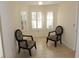 Cozy sitting area filled with natural light featuring neutral walls, tiled flooring, and comfortable seating at 2568 W Brook Ln, Clearwater, FL 33761