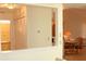 Bright and airy living room with a view into the dining area featuring a closet for storage at 2568 W Brook Ln, Clearwater, FL 33761