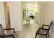 Open room concept showcasing tile flooring, neutral walls, and an open view of the bright kitchen at 2568 W Brook Ln, Clearwater, FL 33761