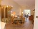 Open floor plan combining the dining and living areas. Natural light from sliding glass doors at 2568 W Brook Ln, Clearwater, FL 33761