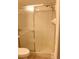 Close up of the shower featuring a glass enclosure and white tiling at 2568 W Brook Ln, Clearwater, FL 33761