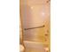 A clean shower with a handrail and tiled walls at 2568 W Brook Ln, Clearwater, FL 33761