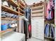 Well-organized walk-in closet with custom shelving and storage solutions at 32826 Knollwood Ln, Wesley Chapel, FL 33545