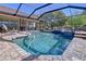 Screened-in pool and patio area with lounge chairs at 32826 Knollwood Ln, Wesley Chapel, FL 33545