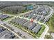 Aerial shot of the home in a well-planned community near a scenic pond at 3975 Night Star Trl, Odessa, FL 33556