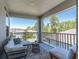 Balcony featuring an outdoor seating area with comfortable furniture and views of the surrounding community at 3975 Night Star Trl, Odessa, FL 33556