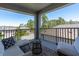 Balcony featuring an outdoor seating area with comfortable furniture and views of the surrounding community at 3975 Night Star Trl, Odessa, FL 33556