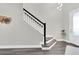 Stylish entryway with hardwood floors, modern staircase, and elegant decor at 3975 Night Star Trl, Odessa, FL 33556