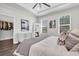 Spacious main bedroom featuring hardwood floors, a walk-in closet and many windows for natural light at 3975 Night Star Trl, Odessa, FL 33556