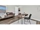 Office with a brown leather couch and a wood desk and chair at 3975 Night Star Trl, Odessa, FL 33556