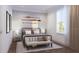 Serene bedroom showcasing a metal frame bed, stylish wall decor, and a large window with natural light at 4112 Southern Valley Loop, Brooksville, FL 34601